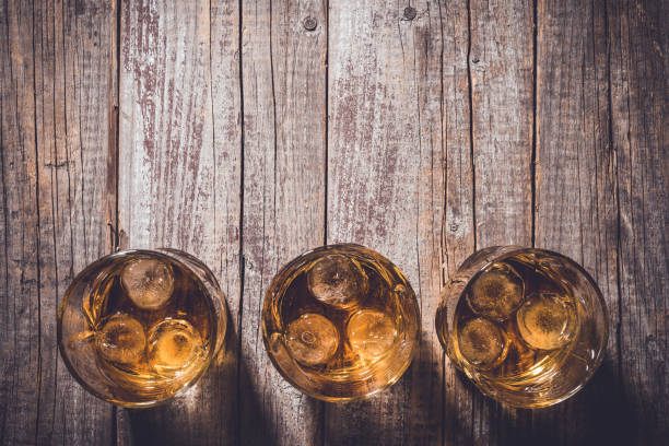 istock Whiskey glasses on an old wooden table. 820112678