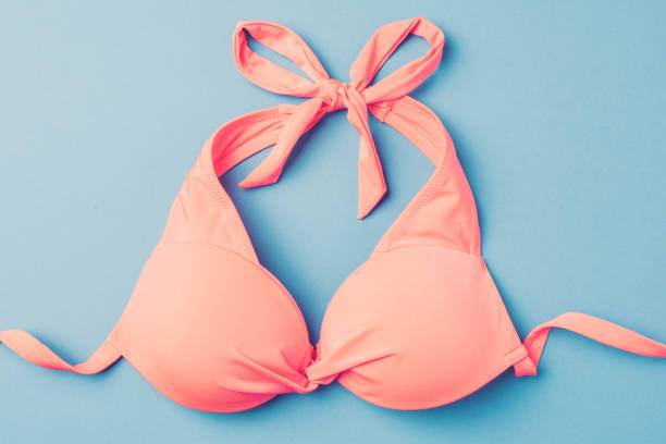istock Pink swimsuit with beach accessories. 820115250