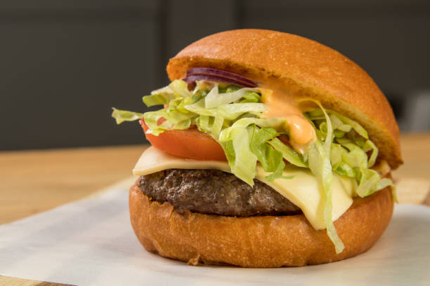 istock hamburguer artisan in table wood background 820130908