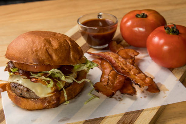 istock hamburguer artisan in table wood background 820135066