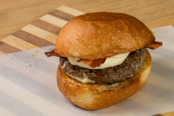 istock hamburguer artisan in table wood background 820138594