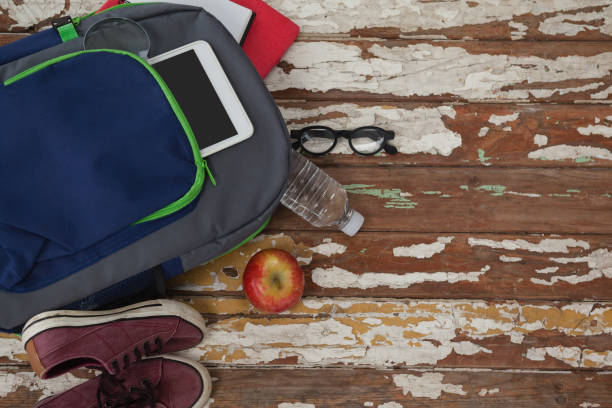 istock Bagpack, water bottle, apple, digital tablet, shoes and spectacle 820140758