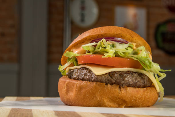 istock hamburguer artisan in table wood background 820158224