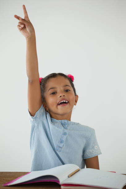 istock Young girl raising her hand 820171444