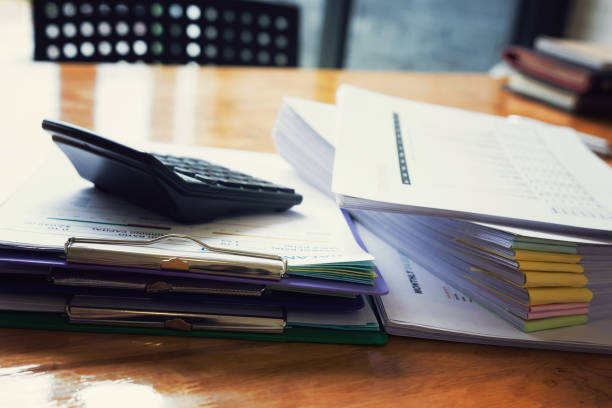 istock Pile of unfinished a bundle documents on office desk, Stack of business paper 820179054