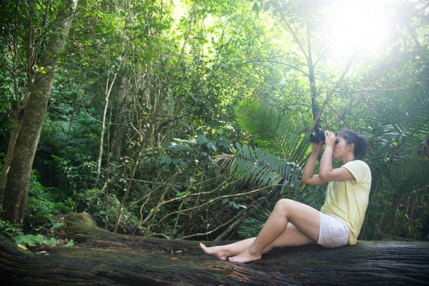 istock Pretty Asian woman looking with  Binoculars. 820196180