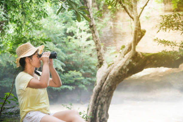 istock Pretty Asian woman looking with  Binoculars. 820196604
