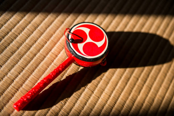Japanese toy drum on tatami mat background