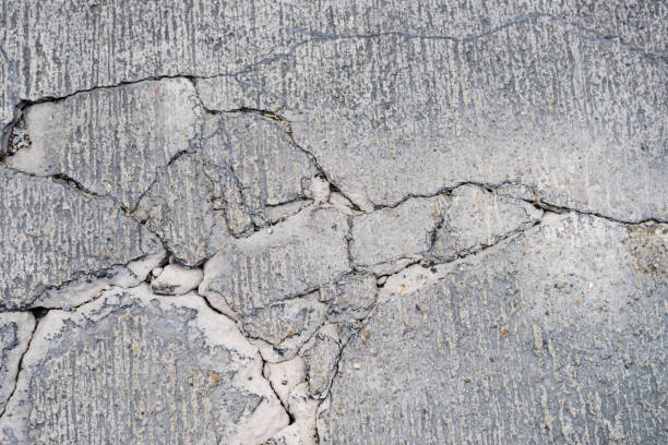 istock top view of cracks on concrete road 820209824