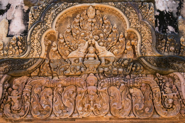 God Siva carved on stone, Banteay Srei temple (Cambodian temple dedicated to the Hindu god Shiva) stock photo