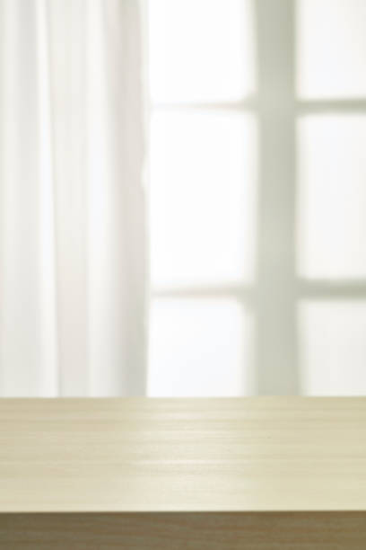 istock working desk with window and curtain background 820237840