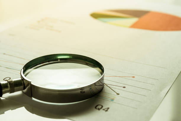 istock Business summary reports and a magnifying glass with on table office. Concept of Data Analysis, Investment Planning, Business Analytics. 820238144