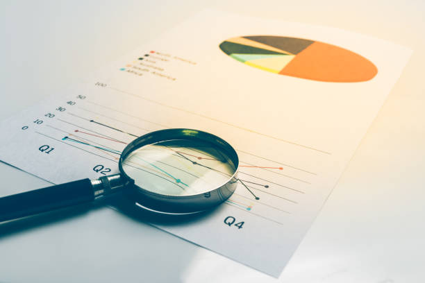 istock Business summary reports and a magnifying glass with on table office. Concept of Data Analysis, Investment Planning, Business Analytics. 820238162