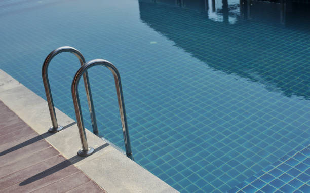 istock water swimming pool with sunny reflections 820242994