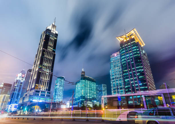 istock urban traffic with cityscape at night 820258294
