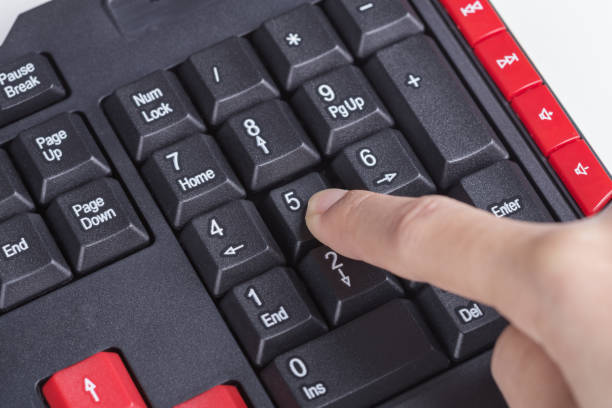 istock finger pushing number button on keyboard of computer 820269438