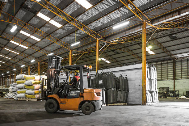 istock Forklift driver standing proud in manufacturing plant 820292556