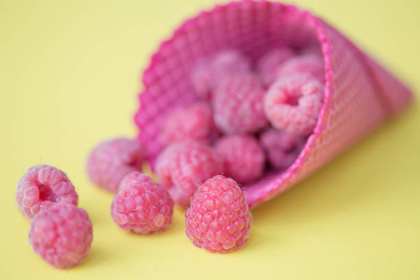 istock Close up of raspberry in ice cream cone 820302440