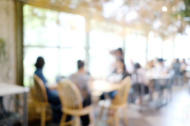 istock Blurred background : blur group of people at restaurant with bokeh light background 820305840