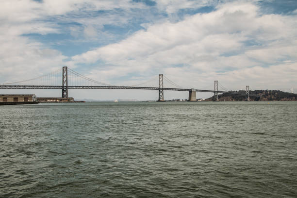 istock Bay bridge from sail boat with grey green looking water 820311808