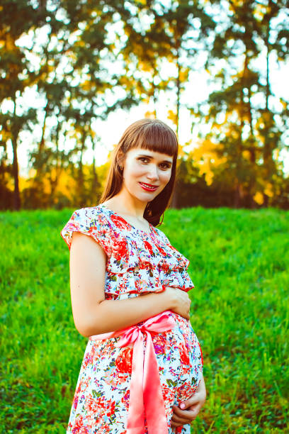 istock Pregnant woman in nature 820329048