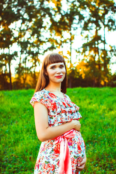 istock Pregnant woman in nature 820329136