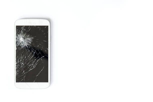 Mobile phone screen is broken. A white mobile phone is broken screen on white background.blank for copy space. isolated colour stock pictures, royalty-free photos & images