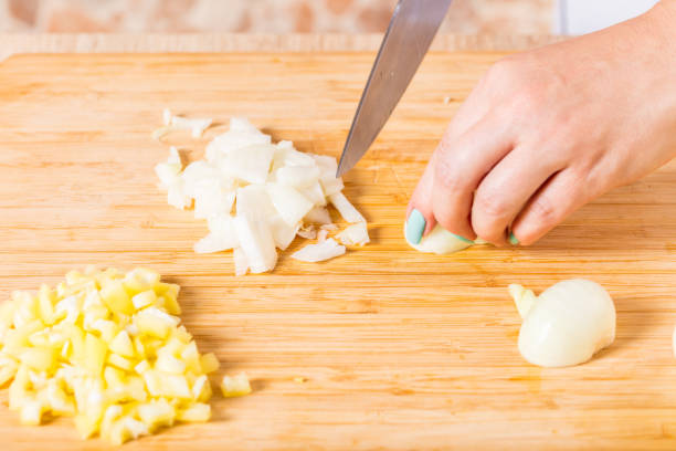 istock Cook cuts onions with a knife 820341638