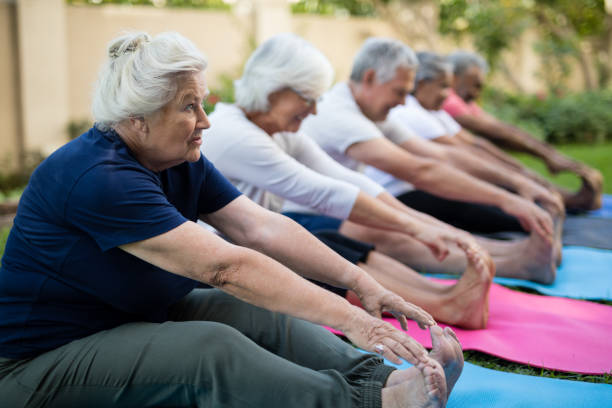 istock Senior female exercising with friends 820349620