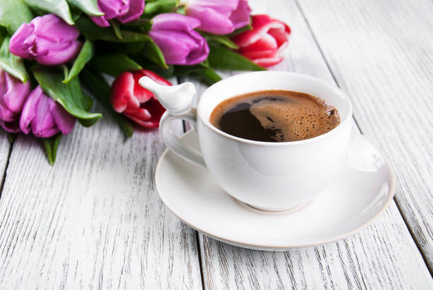 istock cup of coffee with tulips 820349714