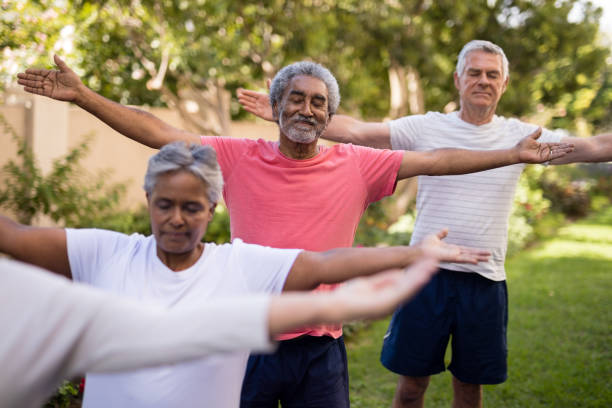 istock Senior friends exercising at park 820350078