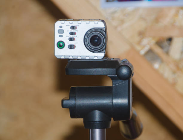 istock camera on tripod shoots into the room 820351738