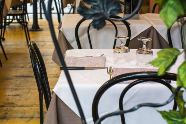 istock Restaurant table with white tablecloth and cutlery 820365872
