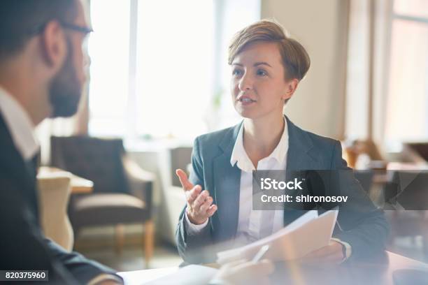 People Negotiating Stock Photo - Download Image Now - Advice, Business, Suit