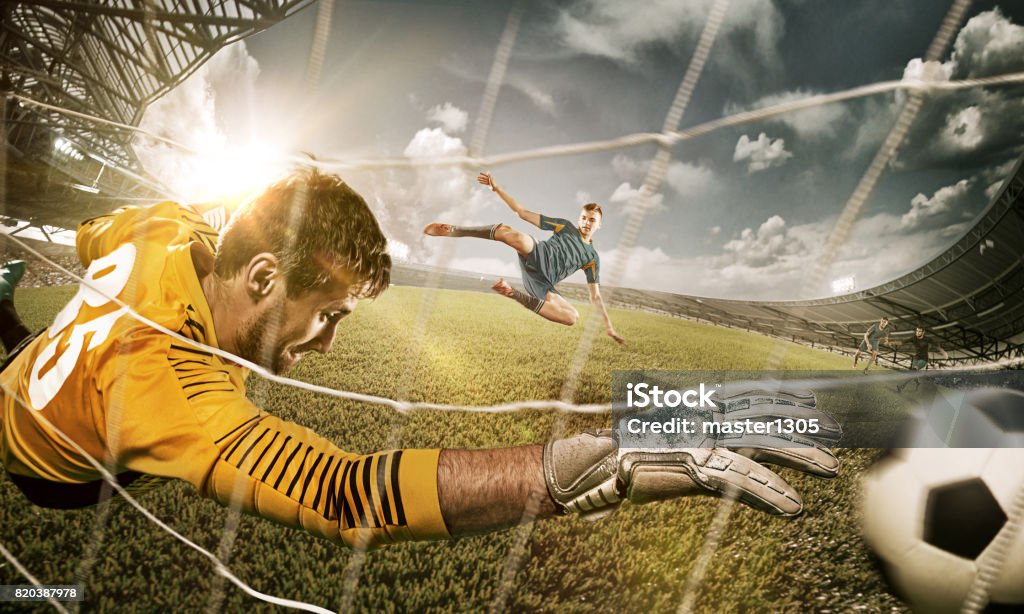 Goalkeeper in gates jumping to catching ball The soccer goalkeeper in gate jumping to catching ball. Collage. Advertising concept of soccer football Action Movie Stock Photo