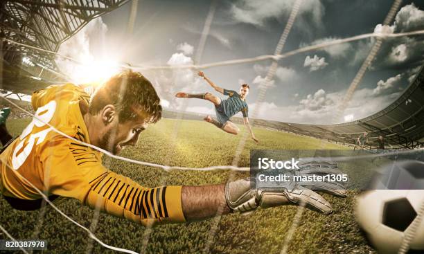 Goalkeeper In Gates Jumping To Catching Ball Stock Photo - Download Image Now - Action Movie, Soccer Player, Soccer