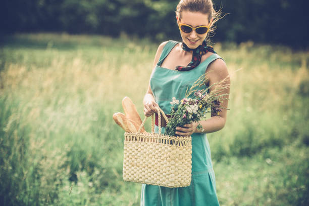 istock Young Woman Walking in the Summer Meadow 820390468