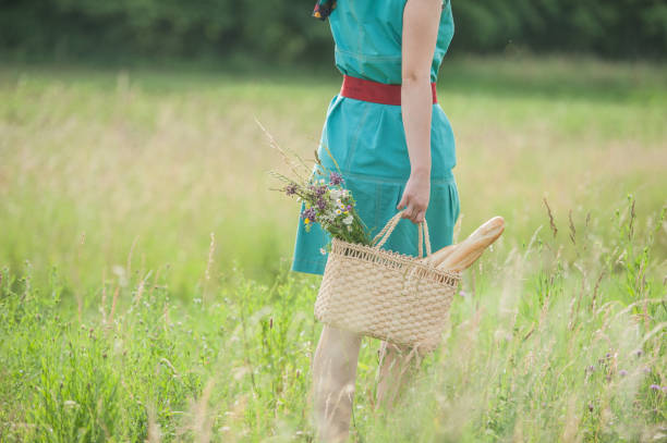 istock Young Woman Walking in the Summer Meadow 820390488