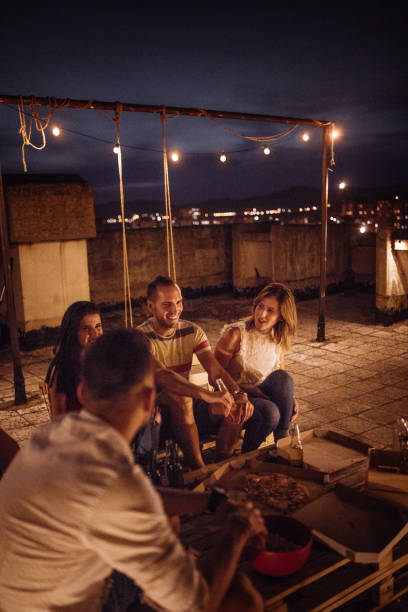 istock Friends at rooftop party 820390906