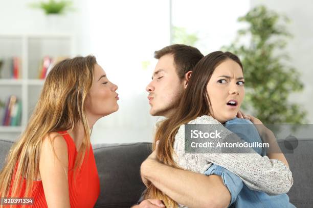 Girlfriend Discovering That Her Boyfriend Is Cheating Stock Photo - Download Image Now