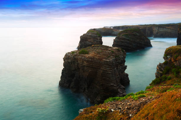Cliffs at  Atlantic Ocean coast of Spain in  twilight