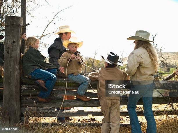 Kids Sitting On Fence Stock Photo - Download Image Now - American Culture, Family, USA