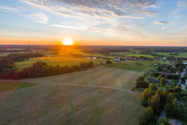 Beautiful sunset over the small town. Aerial photography. stock photo