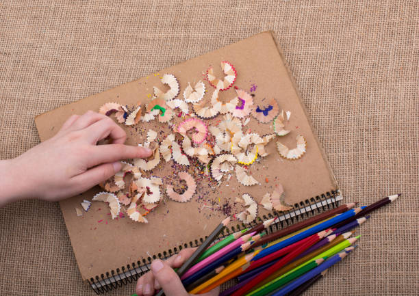 Some colorful pencil shavings and hand