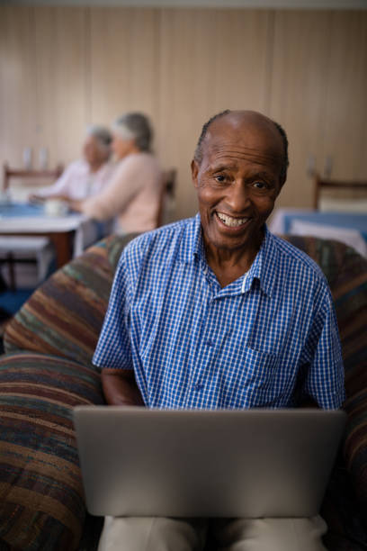 istock Portrait of happy senior man using laptop 820399014