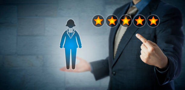 manager showing female employee with five stars - number 1 businessman one finger one person imagens e fotografias de stock
