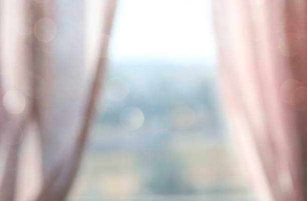 istock Abstract and blurry image of window with curtains 820426816