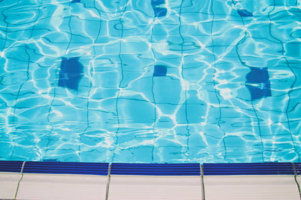 istock top view of swimming pool background 820427240