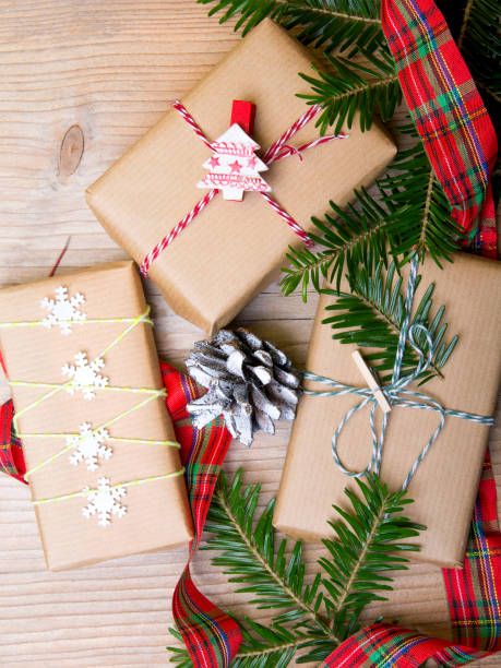 istock Christmas presents on wooden background, retro style with copy space 820437056