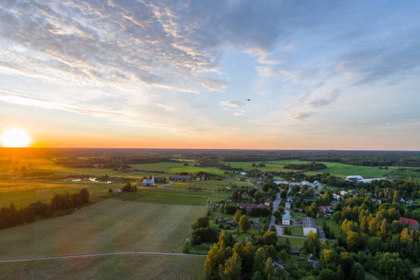 Beautiful sunset over the small town. Aerial photography. stock photo